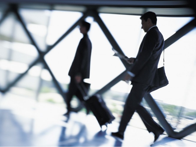 businessman_and_businesswoman_walking_along_a_concourse